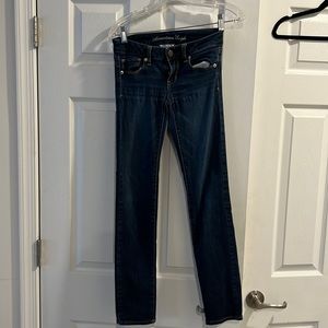 American Eagle size 00 super stretch skinny jeans.  Good used.  Slight damage